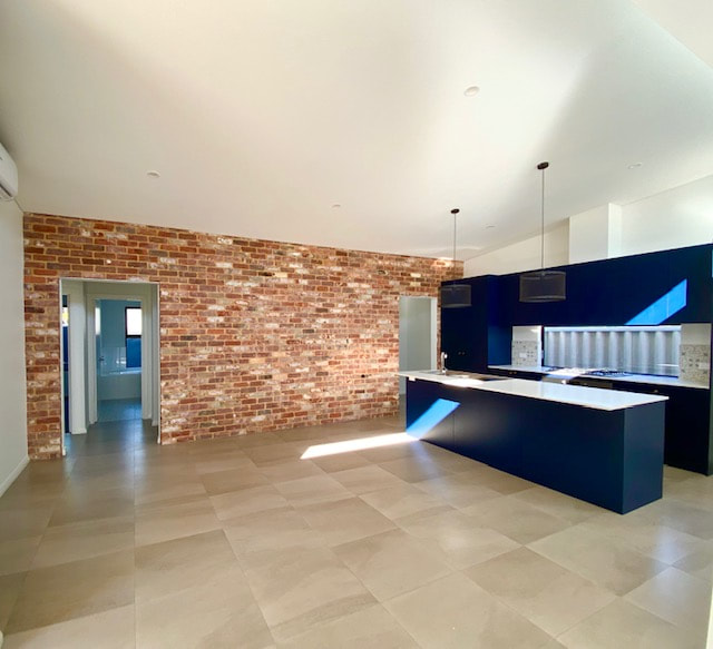 Spearwood New Built Navy Kitchen Feature brick wall 